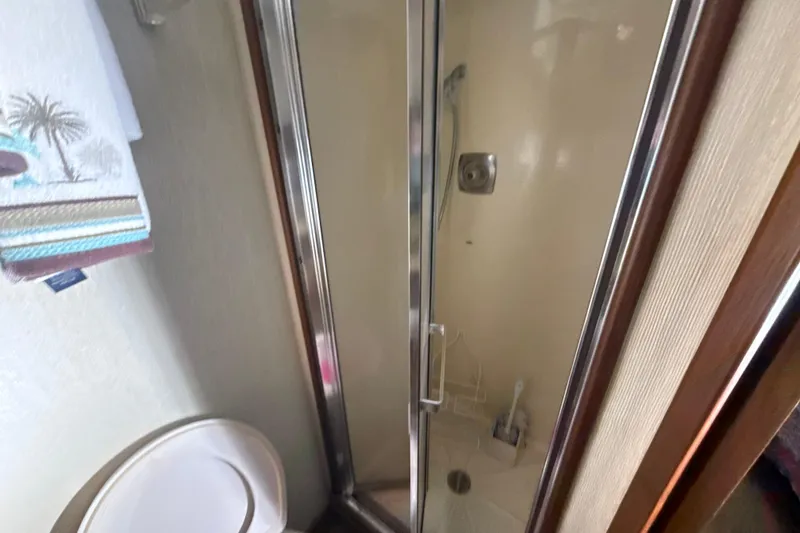 Slide: The Image of Bathroom interior of 1984 Viking 44 Motor Yacht with shower and toilet. - 87