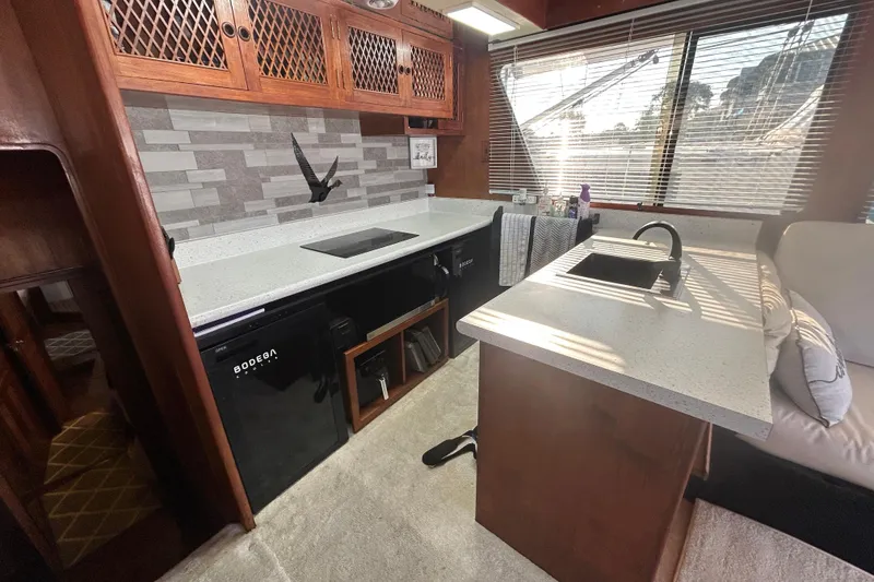 Slide: The Image of 1981 Ocean Alexander 50 Pilothouse kitchen with modern appliances and sleek countertops. - 14