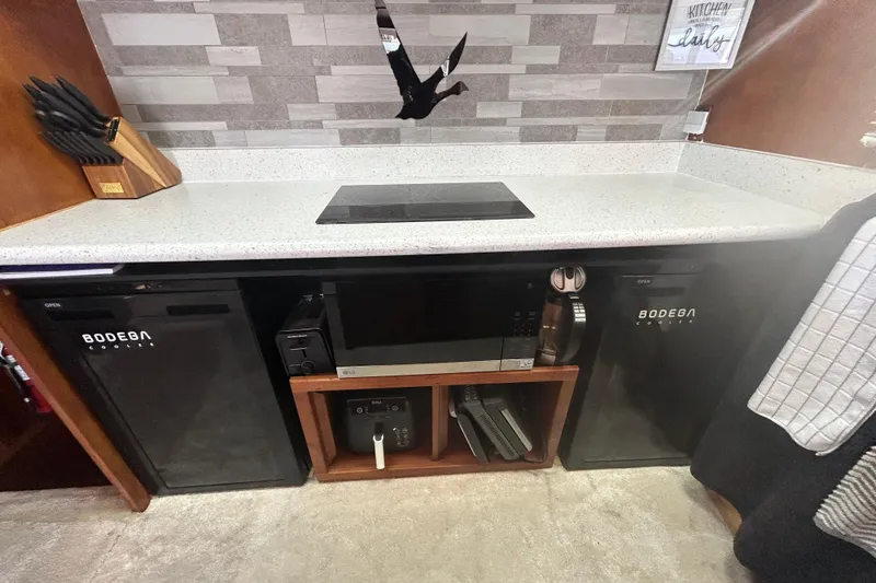 Slide: The Image of Modern kitchen area in 1981 Ocean Alexander 50 Pilothouse yacht with appliances and countertop. - 16