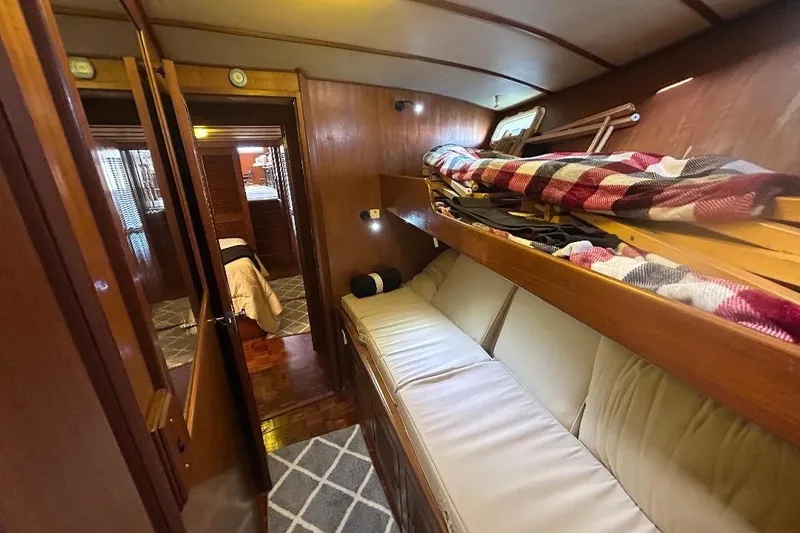 Slide: The Image of Interior of 1981 Ocean Alexander 50 Pilothouse with cozy bunk beds and wooden paneling. - 21