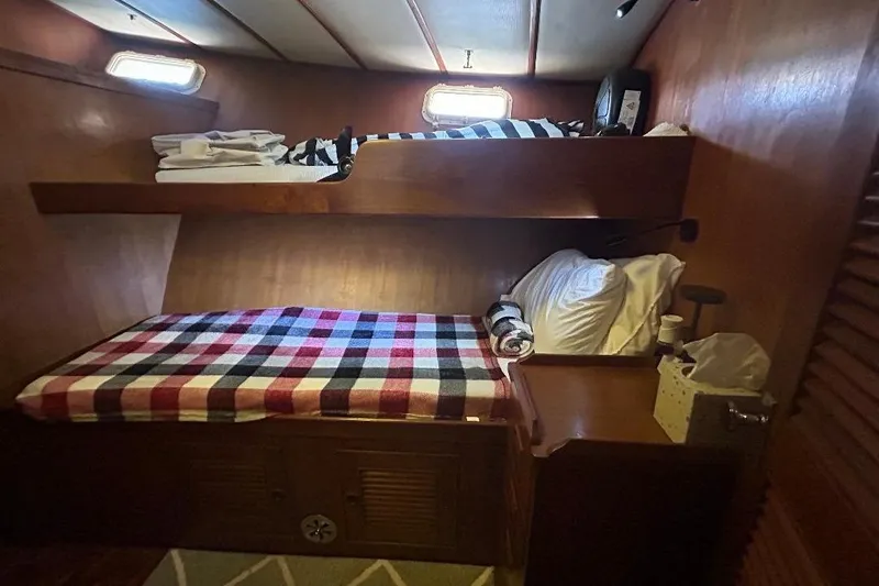 Slide: The Image of Cozy cabin interior of 1981 Ocean Alexander 50 Pilothouse with bunk beds and plaid bedding. - 23