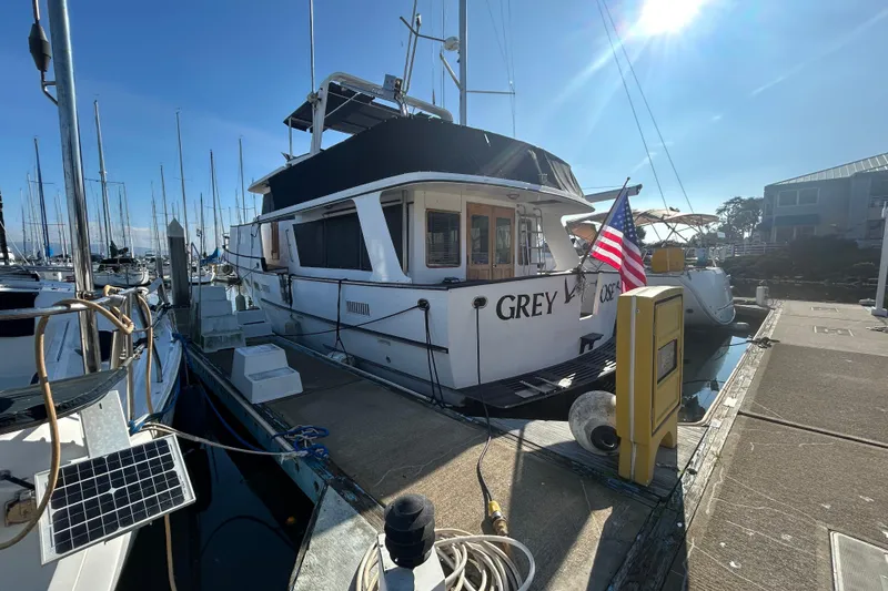 Slide: The Image of 1981 Ocean Alexander 50 Pilothouse docked at marina under clear blue sky. - 3