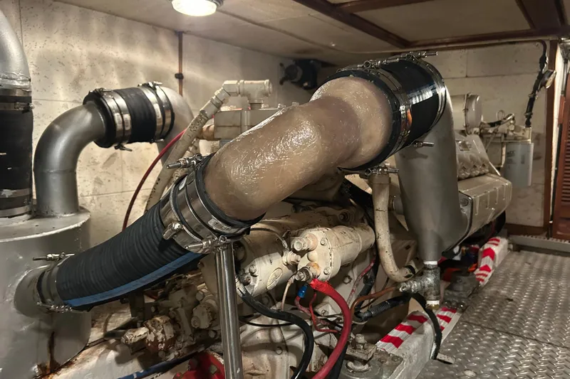 Slide: The Image of Engine room of 1981 Ocean Alexander 50 Pilothouse yacht, showcasing mechanical components. - 34