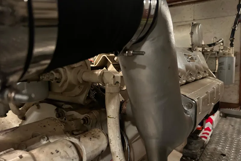 Slide: The Image of Engine room of 1981 Ocean Alexander 50 Pilothouse yacht, showcasing mechanical components. - 37