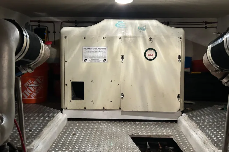 Slide: The Image of Engine room of 1981 Ocean Alexander 50 Pilothouse with generator and equipment. - 38