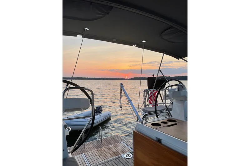 Slide: The Image of Jeanneau 51 sailboat at sunset, 2019 model, with scenic ocean view. - 13