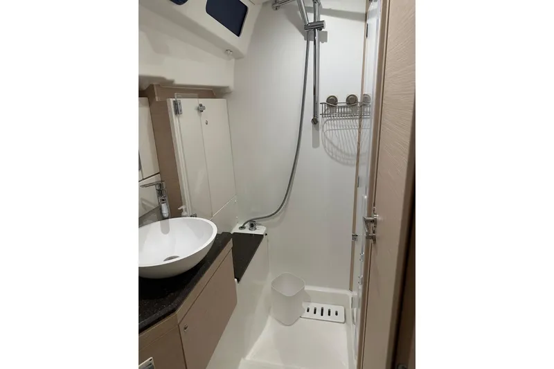 Slide: The Image of Modern bathroom in 2019 Jeanneau 51 yacht with shower and sink. - 23