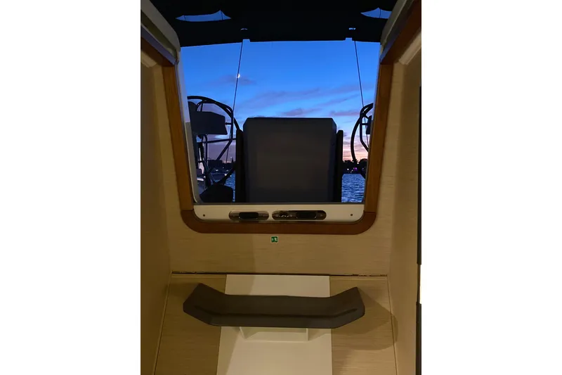 Slide: The Image of Interior view of 2019 Jeanneau 51 yacht at sunset, showcasing helm and ocean. - 3