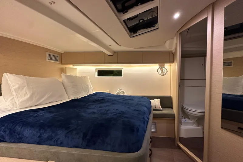 Slide: The Image of Luxurious interior cabin of 2019 Jeanneau 51 yacht with cozy bed and ensuite bathroom. - 35