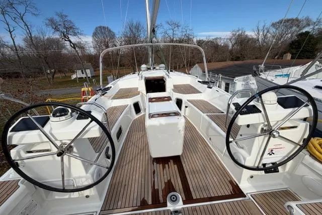 Slide: The Image of 2019 Jeanneau 51 sailboat with dual steering wheels and teak deck. - 44