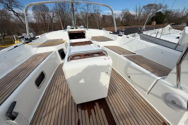 Slide: The Image of 2019 Jeanneau 51 yacht deck with sleek wood finish and spacious seating. - 45