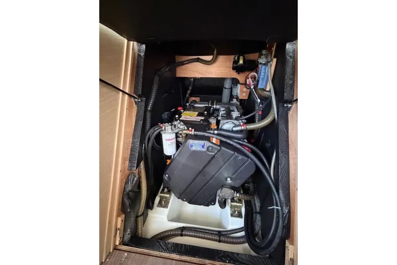 Slide: The Image of Engine compartment of a 2019 Jeanneau 51 sailboat, featuring a Yanmar engine. - 51