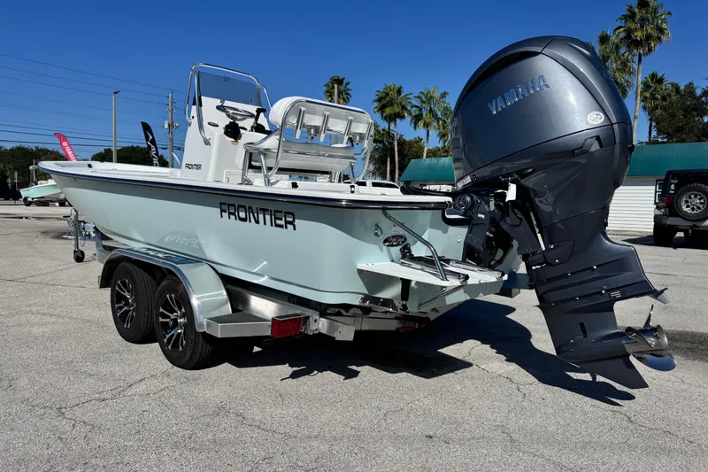 The Image of Frontier 2104 boat, 2026 model, with Yamaha outboard motor on a trailer. - 1