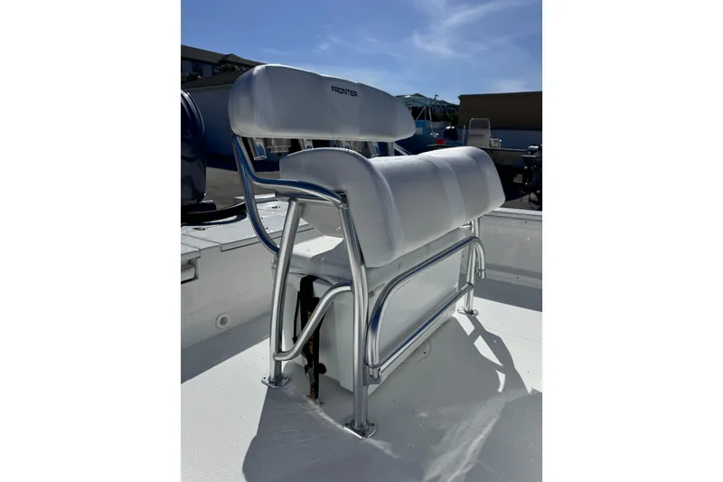 Slide: The Image of Frontier 2104 boat seat, 2026 model, with white upholstery and metal frame. - 11