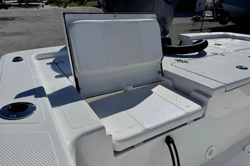 Slide: The Image of 2026 Frontier 2104 boat with open storage compartment and seating area. - 13