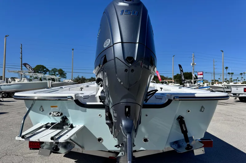 Slide: The Image of 2026 Frontier 2104 boat with powerful 150 engine, displayed outdoors under clear blue sky. - 4