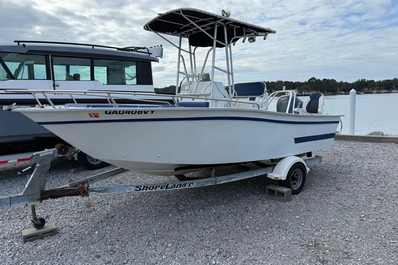 Slide: The Image of 1998 Cape Horn 19 CC boat on trailer by the waterfront. - 1