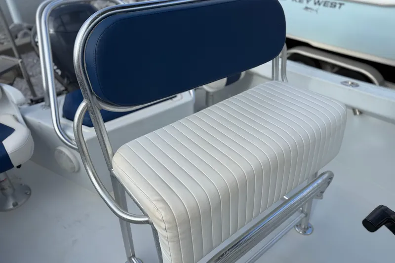 Slide: The Image of 1998 Cape Horn 19 CC boat seat with blue and white upholstery. - 13