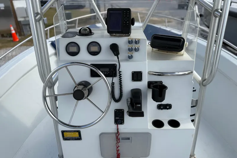 Slide: The Image of 1998 Cape Horn 19 CC boat console with steering wheel and navigation equipment. - 15