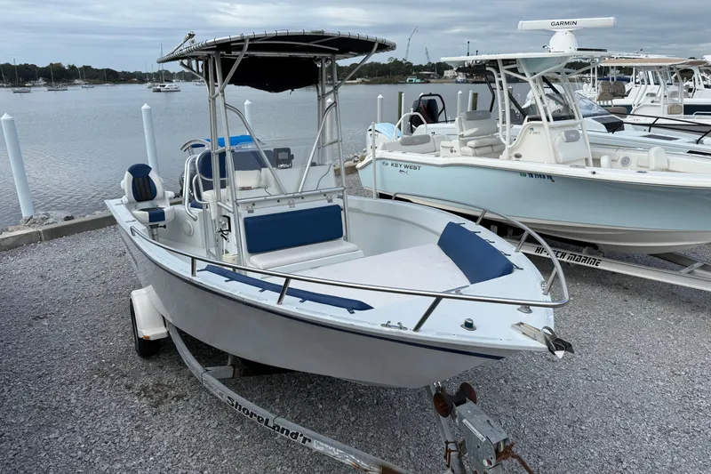 Slide: The Image of 1998 Cape Horn 19 CC boat on trailer by waterfront, overcast sky. - 9