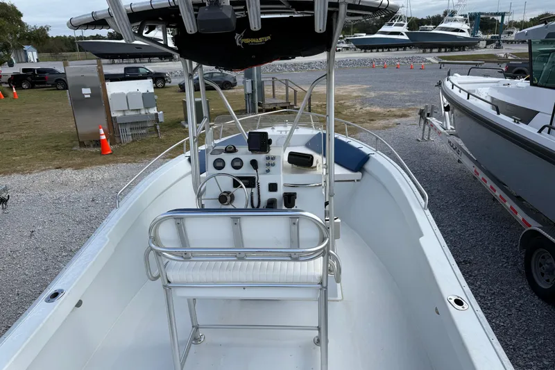 Slide: The Image of 1998 Cape Horn 19 CC boat interior with steering console and seating. - 14