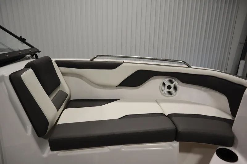 Slide: The Image of 2020 Yamaha AR210 boat interior with black and white seating and speaker. - 13