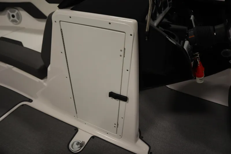 Slide: The Image of 2020 Yamaha AR210 boat interior with storage compartment and control panel. - 17