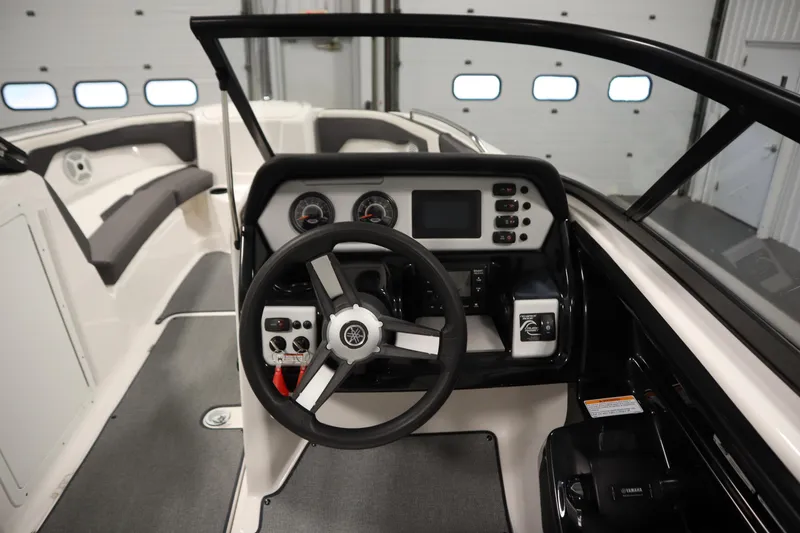 Slide: The Image of 2020 Yamaha Boats AR210 dashboard with steering wheel and control panel. - 19