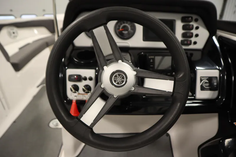 Slide: The Image of Steering wheel and dashboard of 2020 Yamaha Boats AR210. - 20