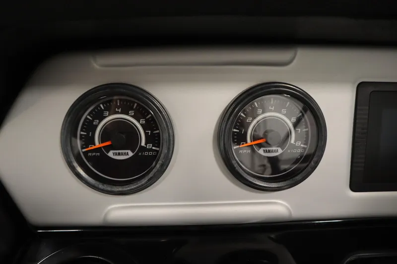 Slide: The Image of Dashboard of 2020 Yamaha AR210 boat showing dual RPM gauges. - 22