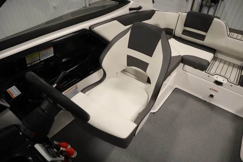 Slide: The Image of 2020 Yamaha Boats AR210 interior with sleek seating and modern dashboard design. - 29