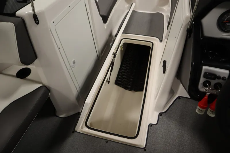 Slide: The Image of 2020 Yamaha AR210 boat interior with open storage compartment. - 32