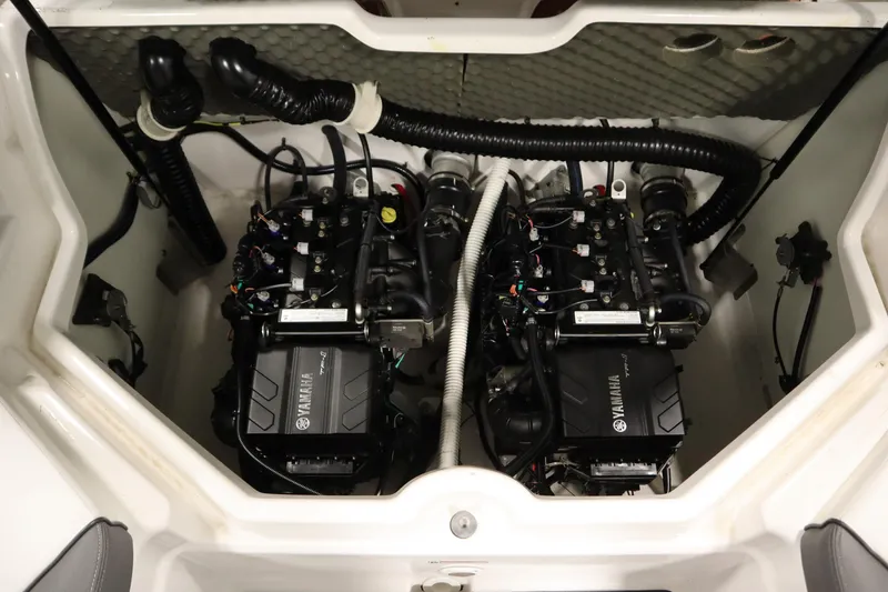 Slide: The Image of 2020 Yamaha AR210 boat engine compartment with dual engines and wiring. - 38