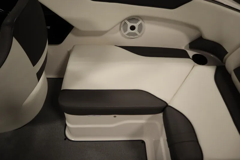 Slide: The Image of 2020 Yamaha AR210 boat interior seating with speaker and cup holder. - 39