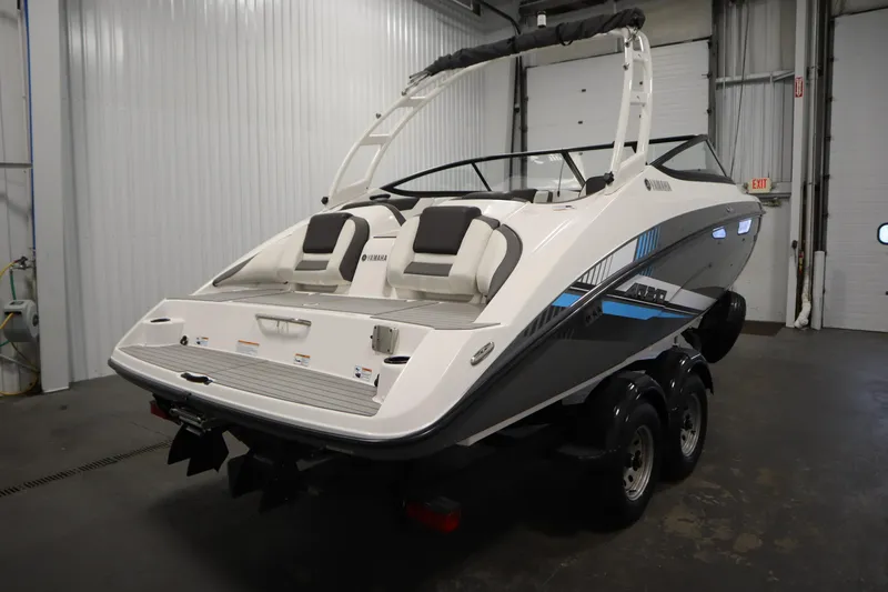 Slide: The Image of 2020 Yamaha Boats AR210 in a garage, showcasing sleek design and modern features. - 4
