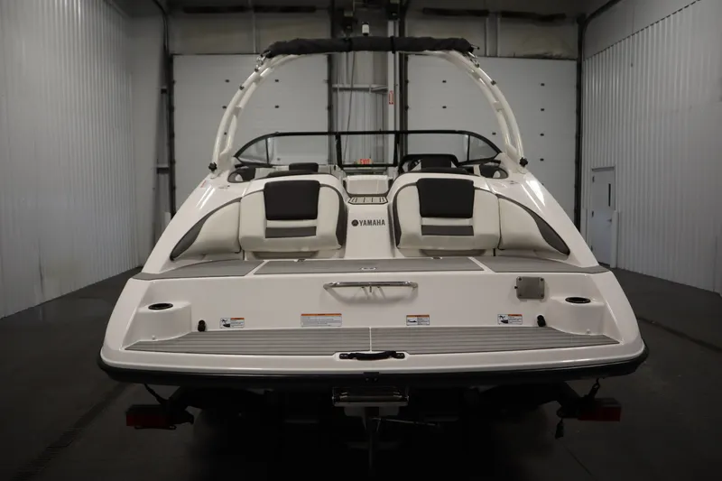 Slide: The Image of 2020 Yamaha Boats AR210, rear view in a garage setting. - 5