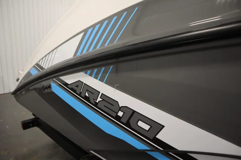 Slide: The Image of 2020 Yamaha Boats AR210 side view with sleek graphics and modern design. - 51