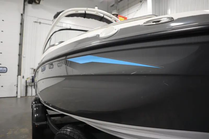 Slide: The Image of 2020 Yamaha Boats AR210 in a garage, showcasing sleek design and modern features. - 52