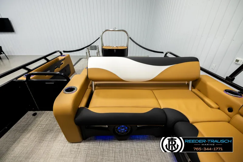 Slide: The Image of 2026 Avalon LSZ VRB boat interior with tan and black seating, cup holders, and modern design. - 15