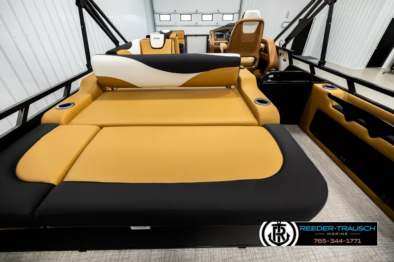 Slide: The Image of 2026 Avalon LSZ VRB boat interior with tan and black seating, cup holders, and modern design. - 16