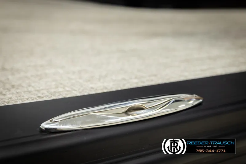 Slide: The Image of 2026 Avalon LSZ VRB boat detail with sleek chrome cleat, Reeder-Trausch Marine branding. - 61