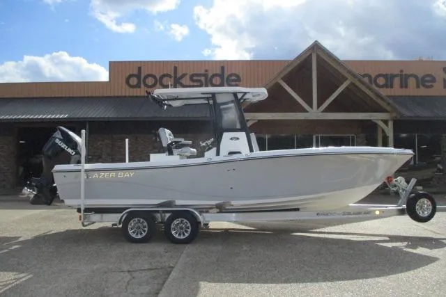 The Image of 2026 Blazer Bay Makaira 2600 boat on trailer in indoor showroom. - 0