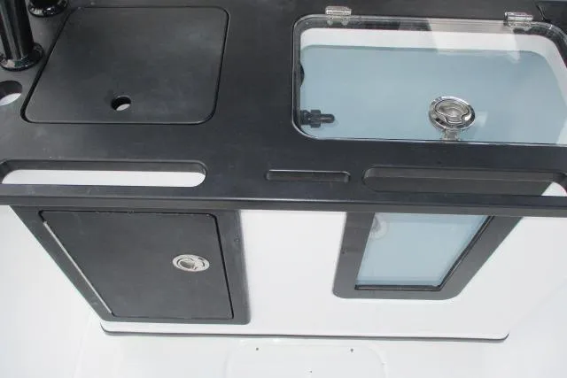 Slide: The Image of 2026 Blazer Bay MAKARIA 2600 boat console with speakers and storage compartments. - 11