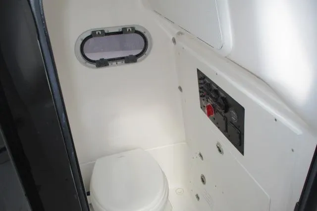 Slide: The Image of 2026 Blazer Bay MAKARIA 2600 boat interior with cushioned seating and storage compartments. - 29