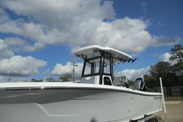 Slide: The Image of 2026 Blazer Bay MAKARIA 2600 boat on trailer, parked outdoors under cloudy sky. - 3