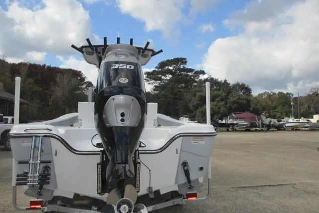 Slide: The Image of Blazer Bay MAKARIA 2600 boat, 2026 model, featuring a sleek T-top design against a cloudy sky. - 34