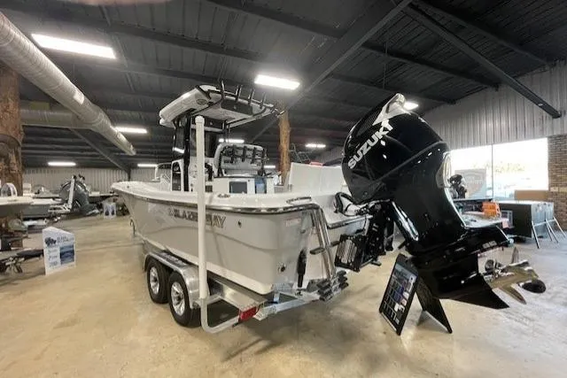 Slide: The Image of 2026 Blazer Bay Makaira 2600 boat with Suzuki engine in showroom. - 40