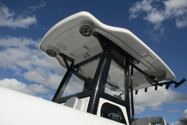 Slide: The Image of 2026 Blazer Bay MAKARIA 2600 boat on trailer under cloudy sky. - 5