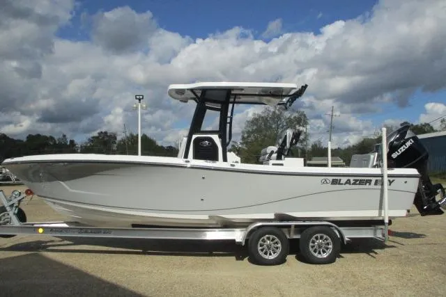 Slide: The Image of 2026 Blazer Bay MAKARIA 2600 boat with Suzuki engine, under a cloudy sky. - 9