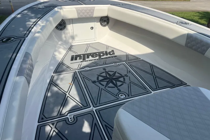 Slide: The Image of 1990 Intrepid 28 Open boat interior with custom flooring and seating. - 8